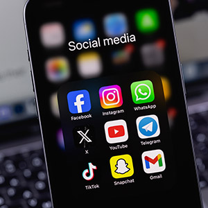 Social media apps on smartphone showing impact on divorce proceedings in Nebraska courts